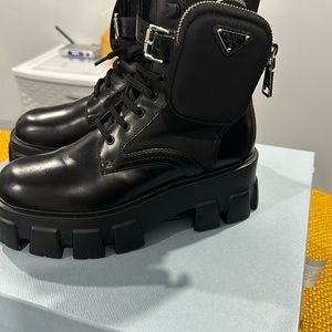 Black Prada boot with pocket. Size 7.5 worn once. There are some scratches.